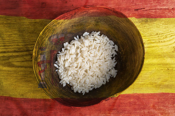 Poverty concept, bowl of rice with Spain flag