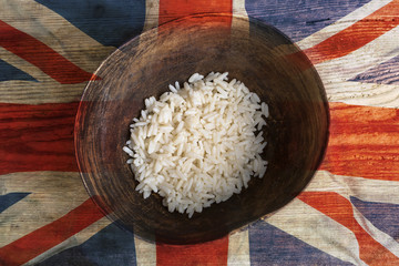 Poverty concept, bowl of rice with UK flag