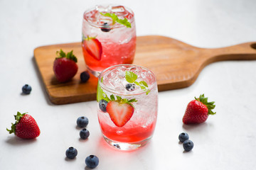 Homemade summer strawberry drink with mint and ice