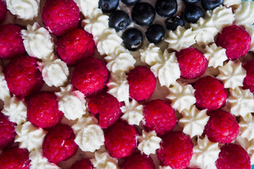 Cake topped with berries to make an American flag