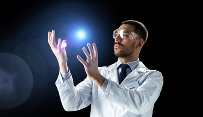 scientist in lab coat and goggles with light