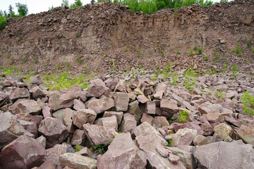 Unused quarry of crimson quartzite. Karelia.