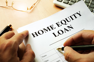 Document with name home equity loan on a desk.