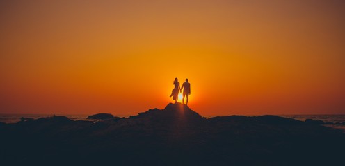the loving couple meets a sunset