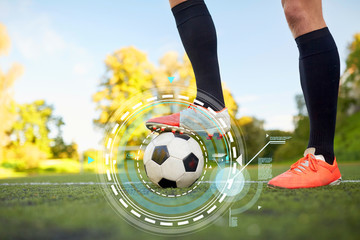 soccer player playing with ball on football field