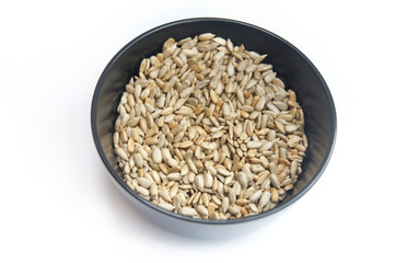 Purified sunflower seeds in a black plate