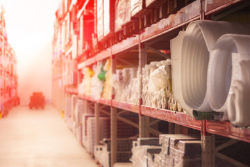 View of warehouse or storehouse. Defocused interior racks and building materials. Abstract Blurred background of interior. Vintage tone.