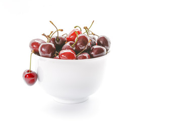 Fresh Cherries in white bowl. Cherries isolated on white background.