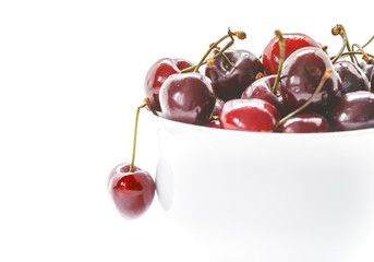 Sweet Cherries in bowl. Closeup of Fresh cherries isolated on white background.