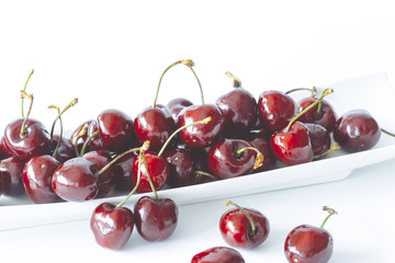 Fresh cherries isolated on white background.