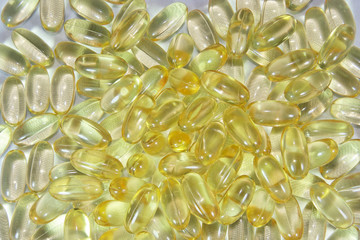 Vitamin E capsules background.