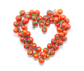 Heart of Cherry tomatoes on white background. Healthy eating concept