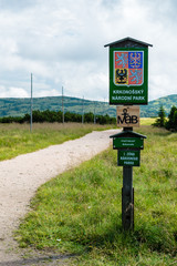 The wooden sign informs of Giant Mountains National Park