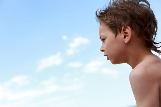 Child on sky background