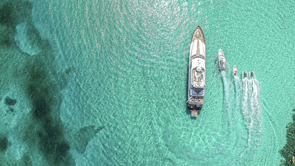 Aerial view of boats and yacht moving in sea at Sandy Toes island