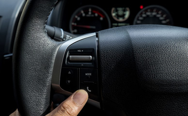 Multiple controls button on steering wheel