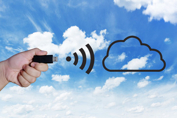 Hand holding USB and sending information with Wireless internet
