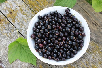 a ripe blackberry is in a dish