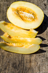 Ripe melon on rustic wooden background