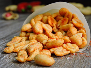 Crispy peanuts with spices and salt. Macro.