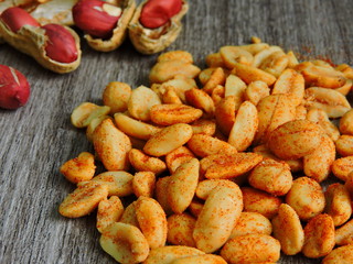 Fresh salted peanuts with chili peppers. Crude peanuts. Macro.