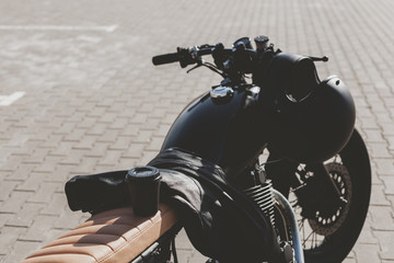 Fototapeta na wymiar Cup of coffee on motorcycle