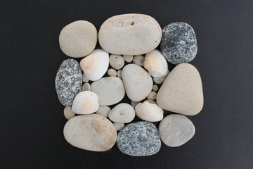 Stones and shells folded in the form of a square