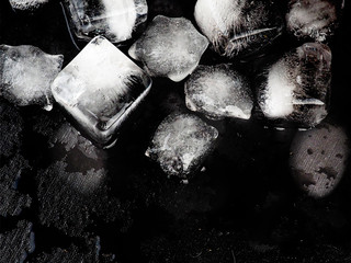 Pieces of crushed ice cubes on black background. Including clipping path.