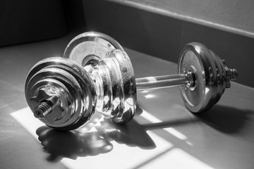 Obraz na płótnie Canvas Heavy silver dumbbells for workout , black and white picture