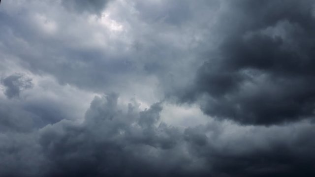 Dramatic storm dark rainy clouds moving over the sky. Stormy and rainy weather timelapse. Hurricane and tornado sky.