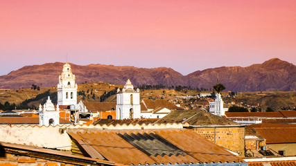 Obraz premium White colonial bell towers and orange rooftops in Sucre, Bolivia, South America.
