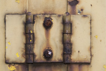 Old door rusty hinge outdoor.
