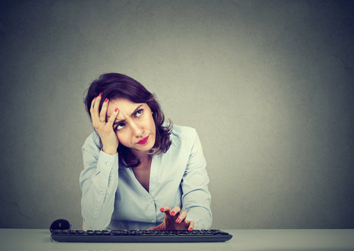 Desperate woman trying to log into her computer forgot password