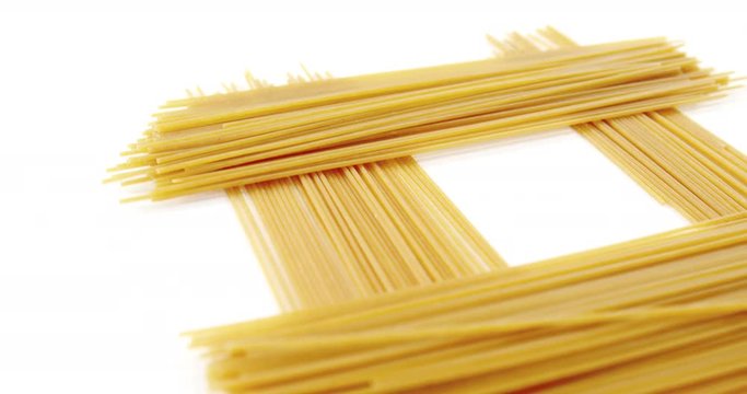 Raw spaghetti on white background