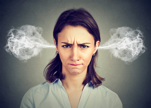 angry young woman, blowing steam coming out of ears