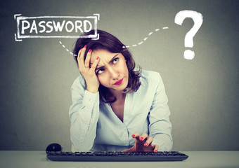 Desperate woman trying to log into her computer forgot password - obrazy, fototapety, plakaty