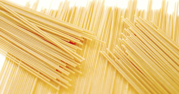 Raw spaghetti on white background