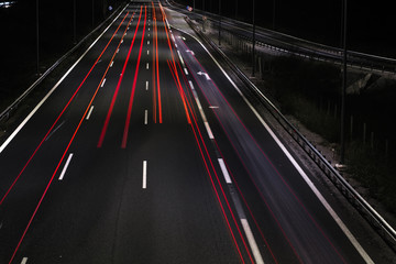 Long exposure of traffic cars lights at night on a highway