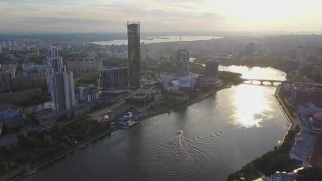 Bird's eye view of city, modern buildings, city river. Beautiful city aerial view. Large modern city center viewed from above