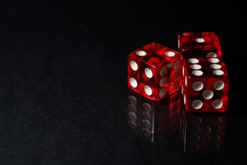 Red Sic Bo gambling dice with black isolated background