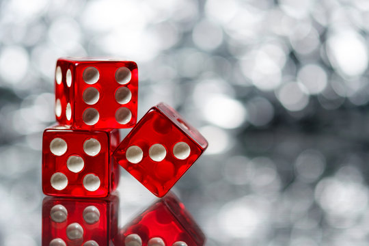 Red Sic Bo gambling dice with sparkling background