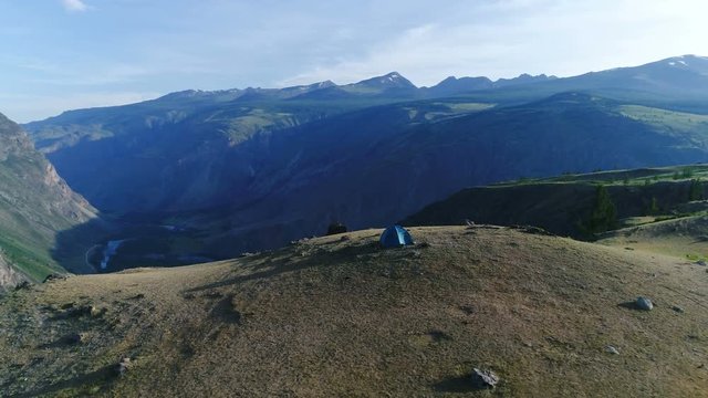 Camping tent on the top of the mountain. aerial slow motion 4k