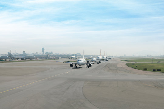 Many airplane prepare takes off from the runway in airport.