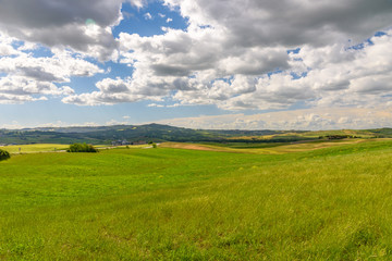 Fototapeta na wymiar View of the countryside of Val'dOrcia Natural Area in Tuscany during spring season