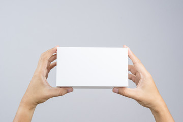 Hand holding blank white box give gift