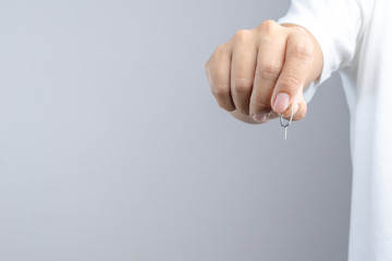 Fototapeta premium Hand holding phone sim card pin