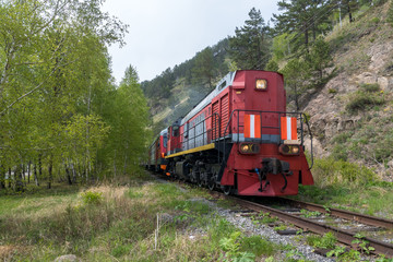 Fototapeta premium Tourist train rides on the Circum-Baikal Railway