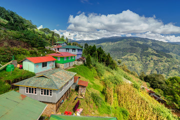 Okhrey village, Himalayan mountain range in the backgroud.