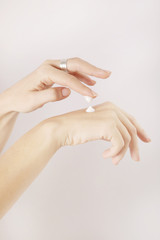 Woman applying hand cream