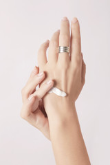 Woman applying hand cream